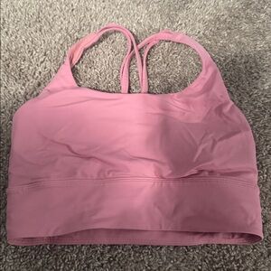 Lululemon energy longline bra in the color pink tide